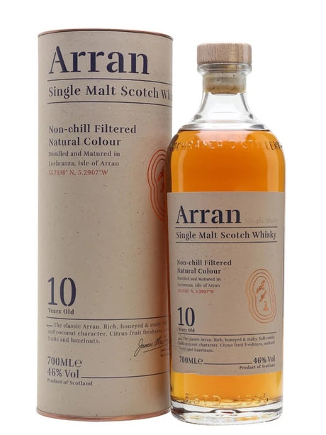 A bottle of Arran 10-year-old Single Malt Whisky 70cl stands beside its cylindrical cardboard box. The whisky has a golden amber hue, and both the bottle and the box showcase the brand's label information, highlighting "Non-chill Filtered" and "Natural Colour.