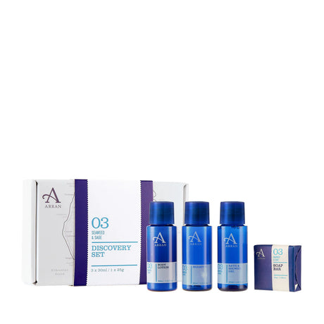 An Apothecary Seaweed and Sage Discovery Gift Set, featuring three blue bottles along with a small boxed soap. The packaging showcases a white and blue design incorporating the brand logo and product information.