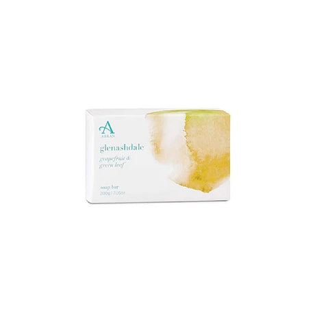 A rectangular package for the Glenashdale Soap Bar, adorned with a watercolor design in yellow and green, features "glenashdale" in white text. It highlights the grapefruit and green leaf scent and contains a bar weighing 200g or 7.0oz.