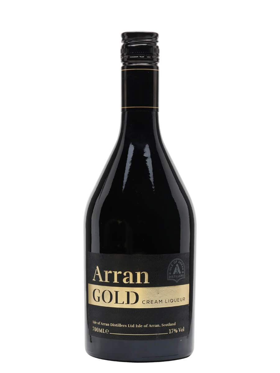 A bottle of Arran Gold Cream Liqueur features a gold and black label with "Arran Gold" prominently displayed. The screw-capped bottle offers notes of vanilla and toffee and bears a badge from Isle of Arran Distillers, Scotland.