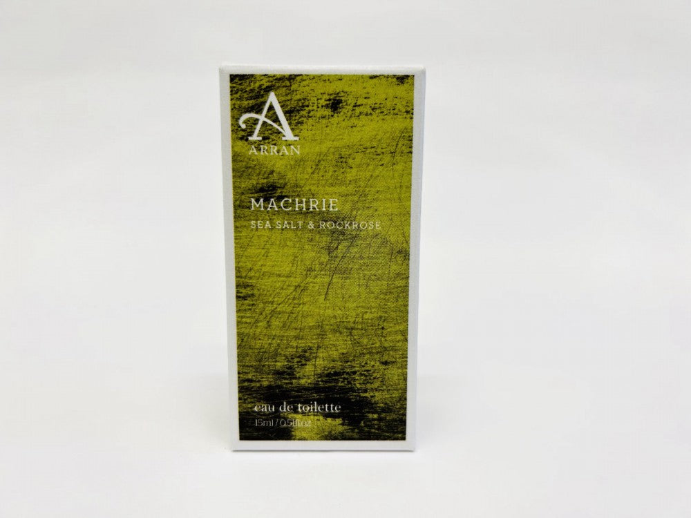 A box of Machrie Eau de Toilette 15ml, inspired by the Isle of Arran, graces a white background. This fragrance captures the essence of sea salt and rock rose, evoking the rugged beauty of its island heritage.