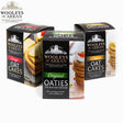 Three packages of Wooleys Oatcakes Mix Pack are displayed, featuring "Original Oaties," "Cheese Oat Cakes," and "Large Oat Cakes." Each package showcases images of stacked oat cakes topped with cheese and vegetables.