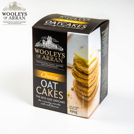 A box of Wooleys of Arran Cheese Oatcakes, featuring an image of stacked oatcakes on the front, boasts "Traditional Family Bakers for Generations" and contains 190g.