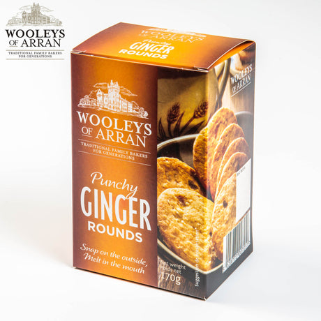 A box of Wooleys of Arran Punchy Ginger Rounds, a sweet treat that delights with its "Snap on the outside, Melt in the mouth" promise. The packaging showcases ginger cookies, and the weight is listed as 170g.