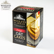 12-pack box of Wooleys of Arran Original Oatcakes, made with wheat flour and traditionally family-baked for a crunchy texture. The 260g packaging features oatcakes topped with cheese slices.